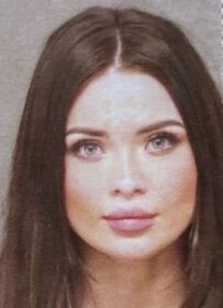 police photo of a beautiful woman with fine features, blue eyes and a perfect smile
