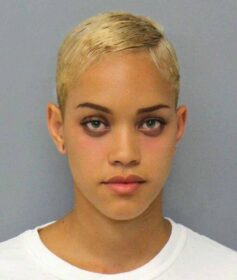 a police photo of a hot looking short haired lady