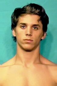 a mugshot of a fashion-model-looking hot male