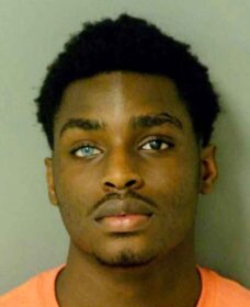 mugshot of intriguing guy with different colored eyes and handsome visage