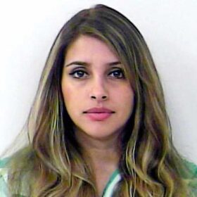 mugshot of hot lady with dark eyes and beautiful hair