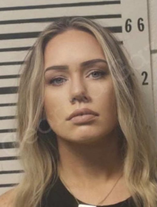 mugshot of the hottest woman with long straigh hair and beautiful blue eyes