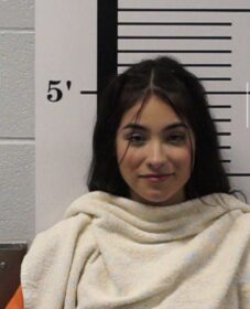 a mugshot of a woman with a very warm and beautiful smile and radiant face