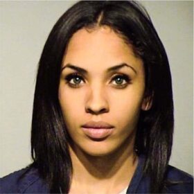 mugshot of a very beautiful woman with green eyes and long hair