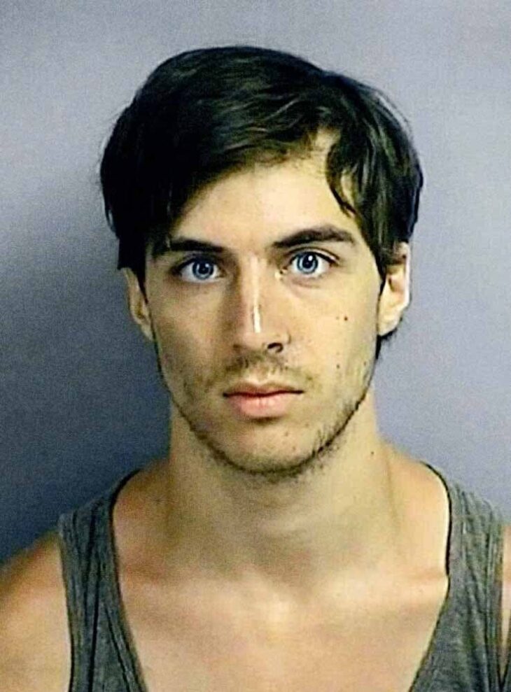 Police photo of a handsome dark haired male